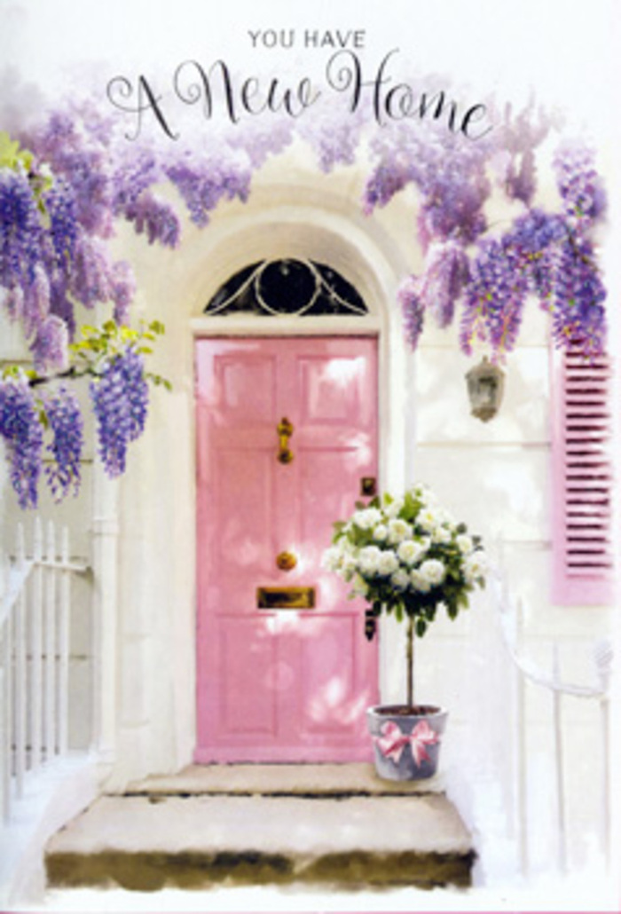 This image captures a tranquil Upminster doorstep that feels ready to welcome someone home after a long day spent wandering through local spots like Upminster Park or the station parade. At the heart of the scene is a painted pink door, its soft, rosy tone balanced by the cool neutrality of whitewashed walls and a delicately coloured shutter. The pastel shades have a slightly weathered charm, suggesting a real home rather than a showpiece: somewhere warm, lived-in, and loved. Draped above the doorway, wisteria spills down in sumptuous, violet-tinged clusters, each trailing strand creating a natural archway. You can almost sense the perfume of the blossoms, that familiar sweet, slightly musky fragrance that fills the air in late spring. The blooms cast dappled shadows across the façade, with flecks of sunlight pooling around the doorstep. There, sitting right against the threshold, is a stylish metal bucket with a soft grey finish, used here as a rustic-chic vase. It is overflowing with creamy white roses, densely petalled and perfectly open, with touches of green foliage emerging between the blooms to break up the ivory tones. A pink ribbon knotted thoughtfully around the base echoes the door colour, pulling the whole composition together with a gentle, coordinated grace. The entire arrangement feels like it has been curated to mark a significant change-perhaps a young couple moving into their first home near Corbets Tey, or a family celebrating a much-awaited return. The mood is peaceful yet full of expectation, as if each petal, each trailing wisteria bloom, quietly wishes good luck, long happiness, and a lifetime of warm welcomes on this Upminster doorstep.